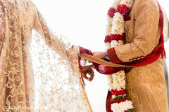 Indian groom holding bride’s hand at wedding ceremony indian bride ceremony fashion,indian wedding ceremony photography,indian wedding outfits