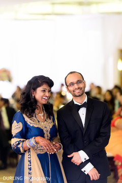Indian couple smiling photography at wedding reception indian wedding mehndi,indian groom suit,bride bangles