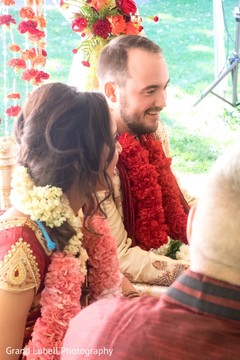 Candid moment during wedding ceremony indian bridal lengha,jaimala,garland