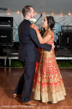 Newlyweds during their first dance indian newlyweds,indian fusion wedding reception,indian bride and groom first dance
