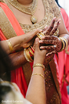 Indian bride trying her bangles before wedding ceremony Indian bride trying her bangles before wedding ceremony