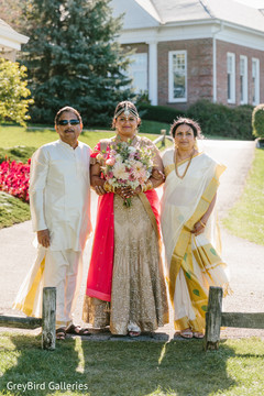 Indian bride and her parents photography before wedding ceremony Indian bride and her parents photography before wedding ceremony