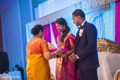 Newlyweds receiving gift yellow sari,bridal lengha,groom fashion