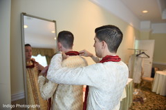 Groom being help to get ready. Groom being help to get ready.