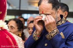 Indian wedding guest feeling emotional at wedding ceremony Indian wedding guest feeling emotional at wedding ceremony