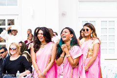 Indian bridesmaids having a good time at wedding ceremony Indian bridesmaids having a good time at wedding ceremony