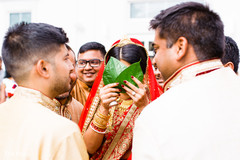 Indian bride covering her face at wedding ceremony Indian bride covering her face at wedding ceremony