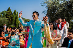Indian groom arriving at wedding ceremony
