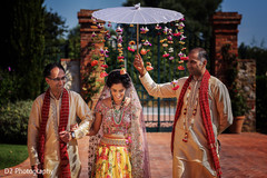 Indian bride and her father walking to wedding ceremony