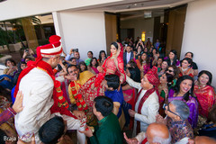 Both parties carry the bride and groom. Both parties carry the bride and groom.