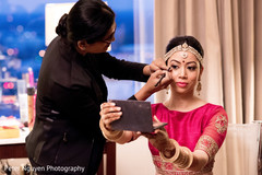 Beautiful indian bride being dolled up for her ceremony Beautiful indian bride being dolled up for her ceremony