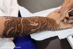 Mehndi artist making a bridal design. indian bridal mehndi,henna,pre- wedding celebrations