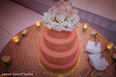 Exquisite wedding cake topper. indian wedding reception,floral and decor,stage,wedding cake,cake topper