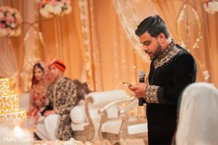 Indian guy saying a couple of words at wedding reception Indian guy saying a couple of words at wedding reception