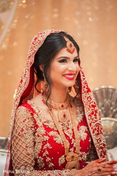 Indian bride smiling photography at wedding reception Indian bride smiling photography at wedding reception