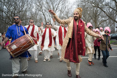 Indian groom and groomsmen dancing at baraat procession Indian groom and groomsmen dancing at baraat procession