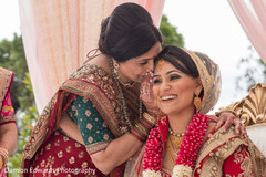 Indian lady saying something to the bride at wedding ceremony bridal tikka,indian bride lengha,indian wedding gallery