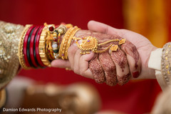 Indian groom holding bride’s hand at wedding ceremony indian bridal mehndi,bride bangles,indian wedding gallery