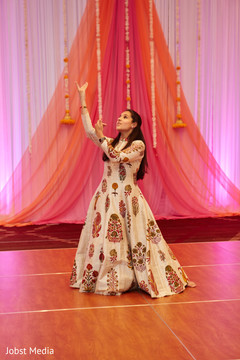 Indian lady dancing at sangeet ceremony Indian lady dancing at sangeet ceremony