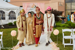 Indian groom walking into wedding ceremony indian groom fashion,indian wedding ceremony floral and decor,indian groomsmen