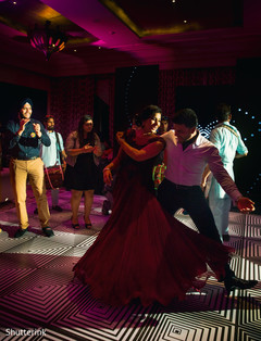 Beautiful indian bride and groom enjoying the wedding reception party