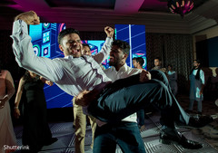 Excited indian groom at wedding reception