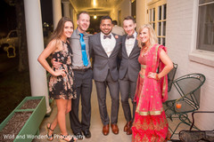 Just married Indian gay couple posing with their wedding guests. Just married Indian gay couple posing with their wedding guests.