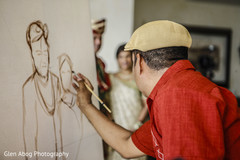 Indian bride and groom getting a paint done Indian bride and groom getting a paint done