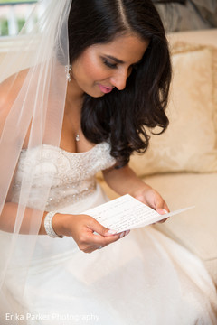 Indian bride reading a letter before wedding ceremony Indian bride reading a letter before wedding ceremony