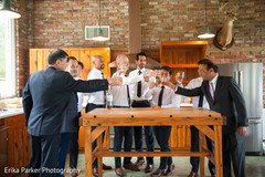 Indian groom's toast before wedding ceremony with groomsmen Indian groom's toast before wedding ceremony with groomsmen