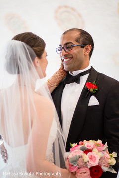 Dazzling indian bride and groom looking at each other Dazzling indian bride and groom looking at each other