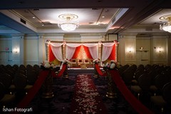 Traditional mandap indoors. indian wedding photography,indian wedding ceremony,floral and decor