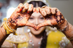 Indian bride showing bridal mehndi art Indian bride showing bridal mehndi art