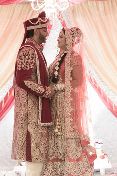 Beautiful indian couple looking at each other indian bride and groom,indian groom outfit,indian bride fashion