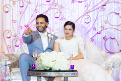 Indian bride and groom at wedding reception indian wedding reception,indian bride reception fashion,indian groom suit