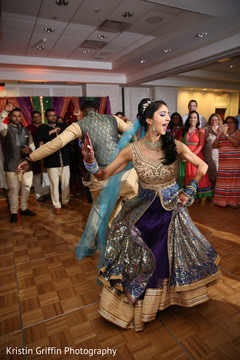 Lovely couple dancing during their sangeet night. sangeet,pre- wedding celebrations,indian bride,indian groom