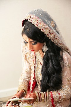 Indian bride ready to read a letter from the groom. indian bride,getting ready,indian bridal fashion