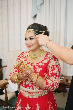 Indian bride getting ready for wedding reception indian bride hair and makeup,indian bride getting ready,bridal jewelry