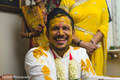 Indian wedding ritual of painting the groom with yellow turmeric paste haldi,haldi ritual,haldi ceremony,pre- wedding celebrations