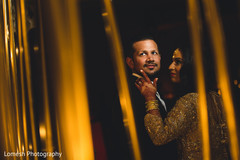 Indian bride and groom posing for photo shoot indian wedding reception,indian bride fashion,indian groom fashion