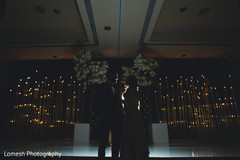 Indian bride and groom at their wedding reception indian wedding reception,lighting,indian bride fashion,indian groom fashion