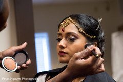 Beautiful indian bride being dolled up for her ceremony indian bride hair and makeup,indian bride,indian bride getting ready