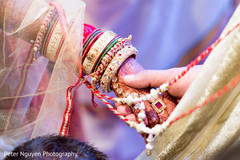 Indian wedding ceremony close up of hands cross to each other bride bangles,bridal mehndi,bridal jewelry,indian wedding ceremony