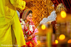 Indian bride at a traditional wedding ceremony indian bride,indian wedding ceremony,floral and decor,mandap
