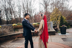 Indian bride and groom's first look Indian bride and groom's first look