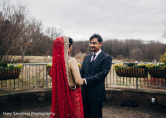 Indian bride and groom looking at each other Indian bride and groom looking at each other