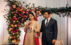indian bride giving a speech indian bride fashion,indian groom suit,indian wedding ceremony,indian wedding ceremony floral and decor