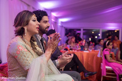 Indian Bride and groom enjoying their sangeet night. Indian Bride and groom enjoying their sangeet night.