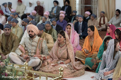 Sikh couple at their wedding ceremony. sikh wedding ceremony,indian wedding photography,sikh bride and groom