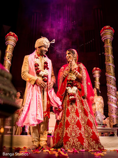 Indian bride and groom looking at each other bridal jewelry,indian bride fashion,indian groom fashion,indian wedding ceremony